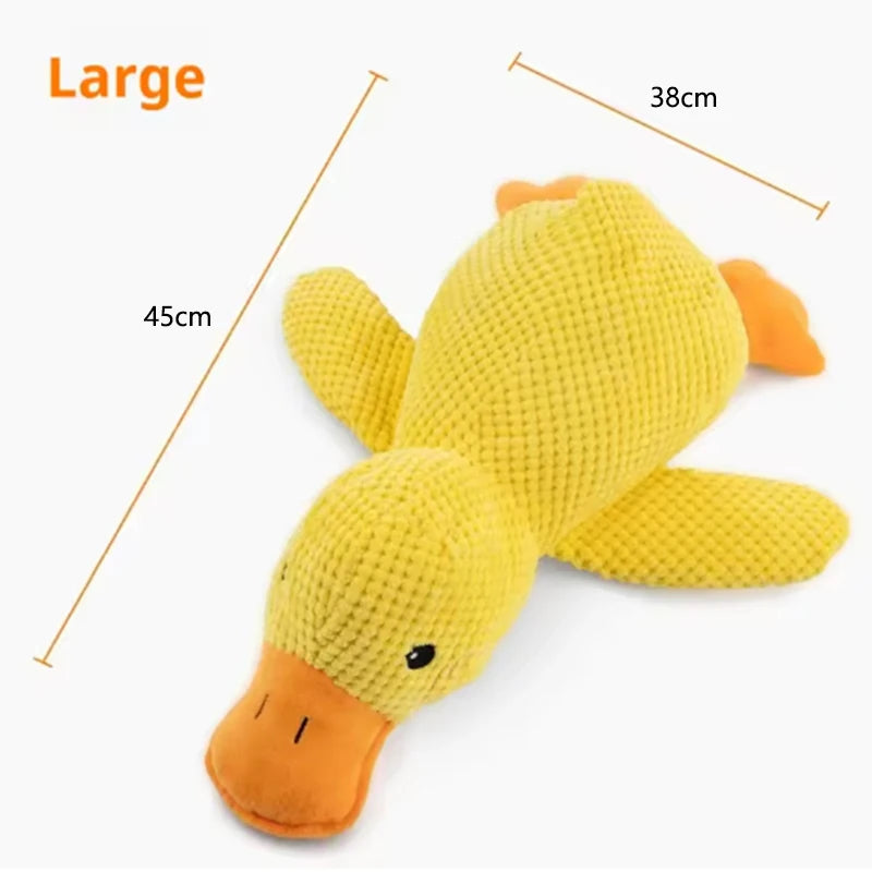 Dog sleeping with a dog hug duck toys to relieve boredom of little yellow duck pet