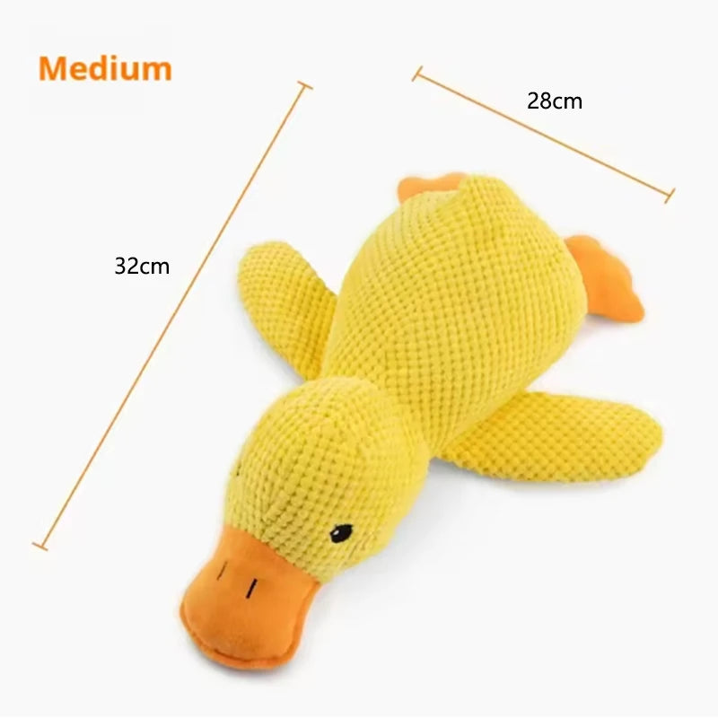 Dog sleeping with a dog hug duck toys to relieve boredom of little yellow duck pet